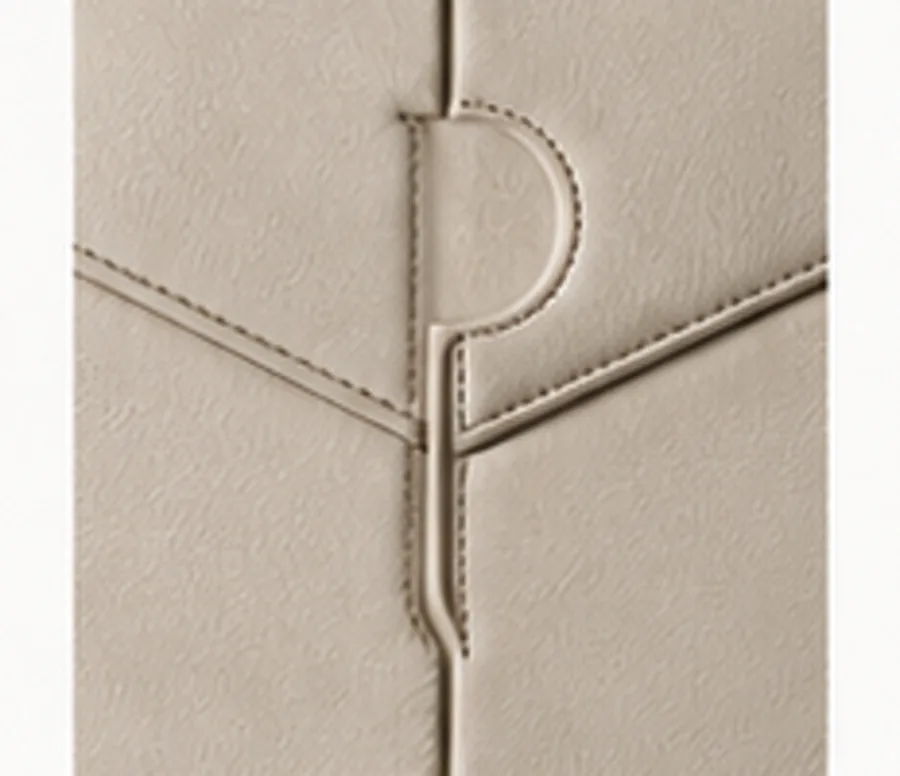 Macro detail of the trademark panel-cut seam turning across bone leather.